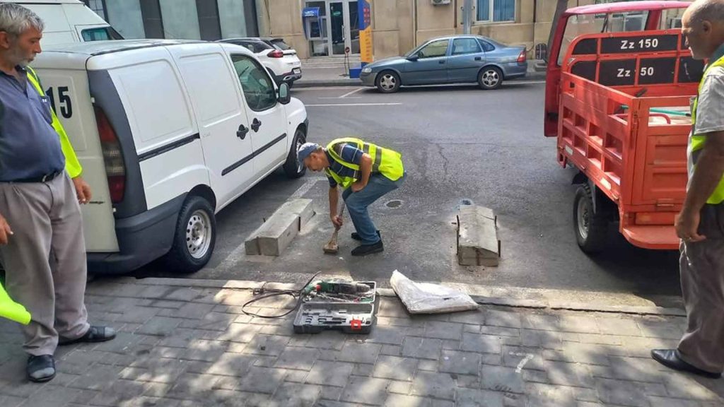 Nəsimi rayonunda divarlar və hasarlar boyanır
