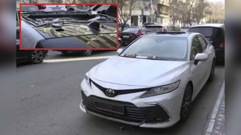 Bakıda binanın fasadından daşlar qoparaq avtomobilin damını sındırıb