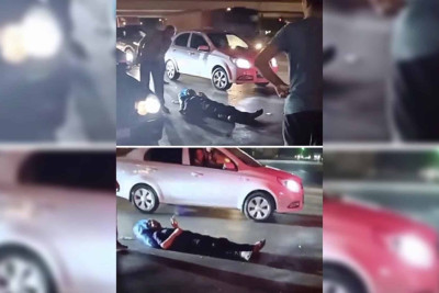 “20 Yanvar” metrosunun yaxınlığında olay: kişi yola uzanaraq siqaret çəkib - VİDEO