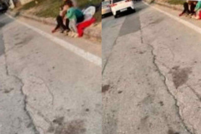 Gəncə prospektində qadın uşaqları ilə dilənir