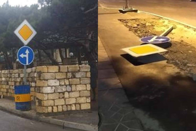 Bakıda yol nişanının ətrafında zibil qutuları üçün meydança tikilib