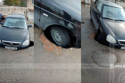 Bakıda maşın çuxura düşdü - VİDEO